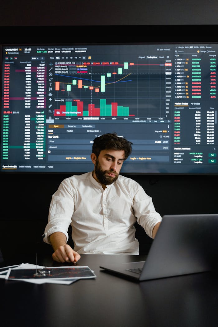 A Bearded Man Working in His Office